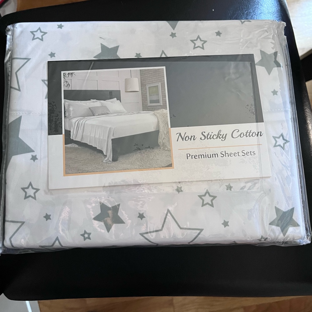 Twin size sheets, in package. Non Sticky Cotton. White w/ grey star pattern.